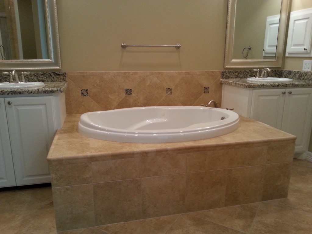 Sunken Tub with Tile Backsplash Delta Home Builders