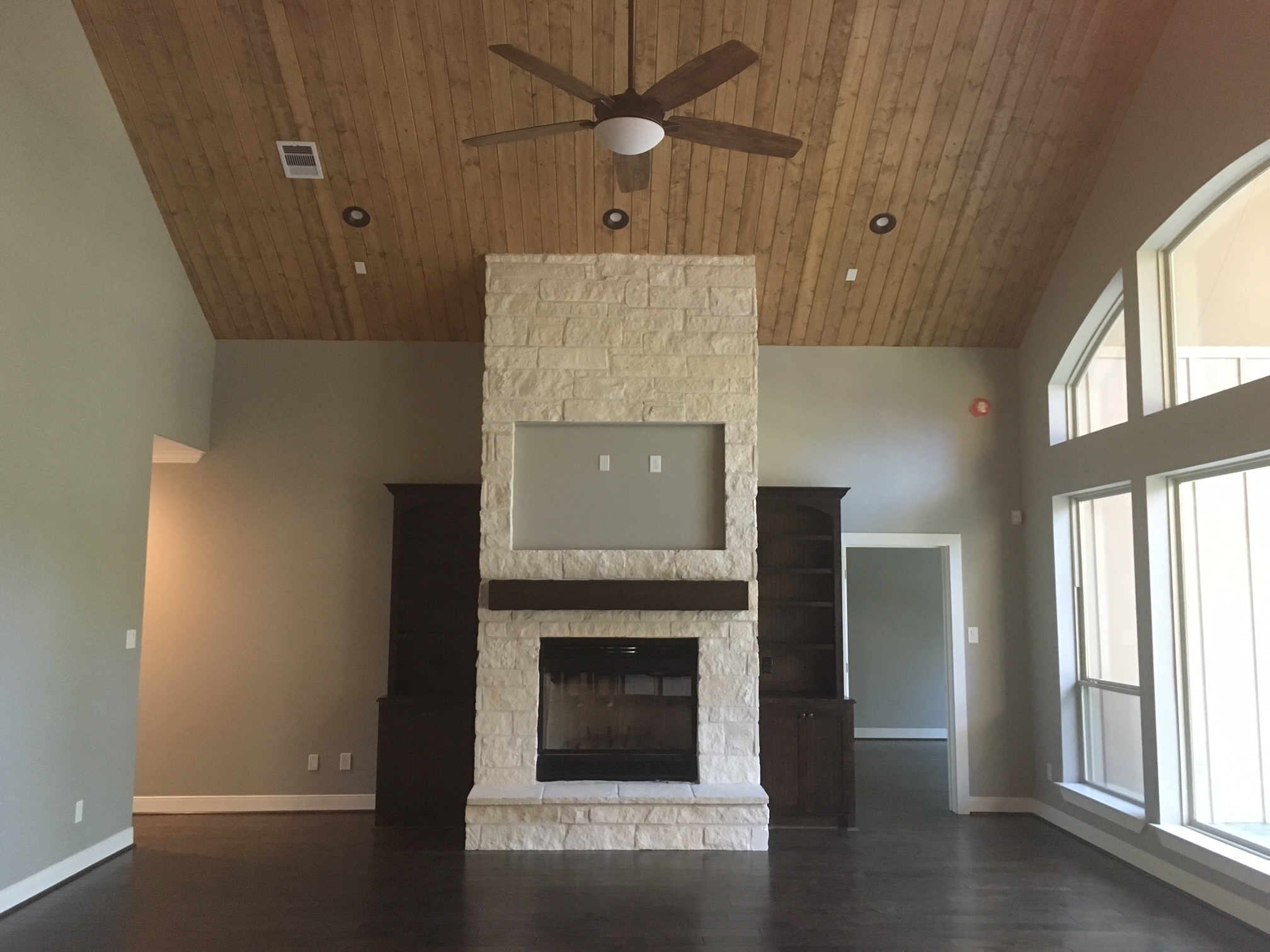 High ceiling with wood ceiling accent