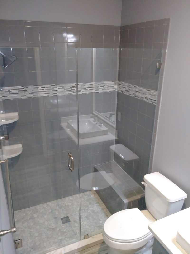 Glass enclosed tiled shower