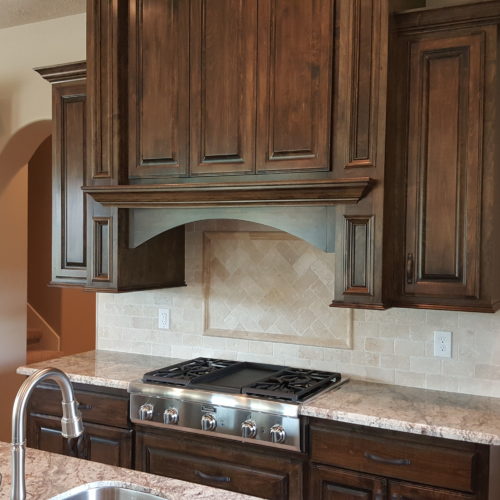 Warm wood cabinets and granite countertops