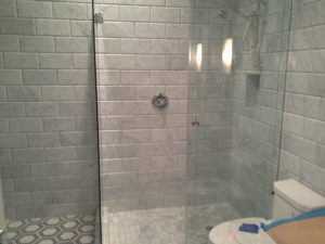 Tiled shower with glass surround