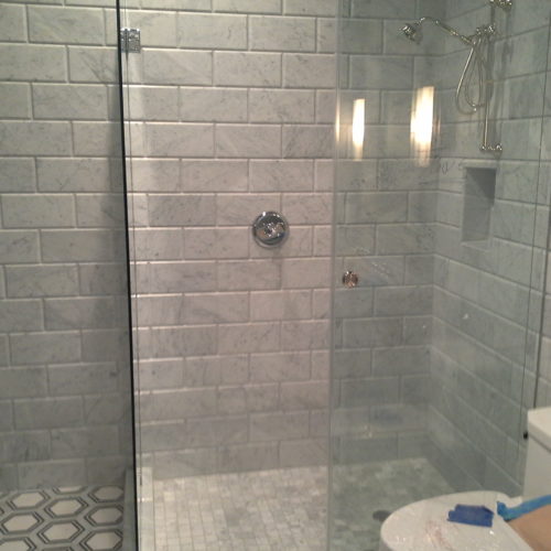 Tiled shower with glass surround