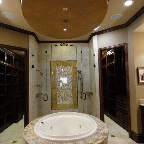 Luxurious whirlpool bath and glass door shower