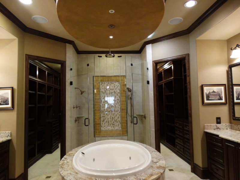 Luxurious whirlpool bath and glass door shower